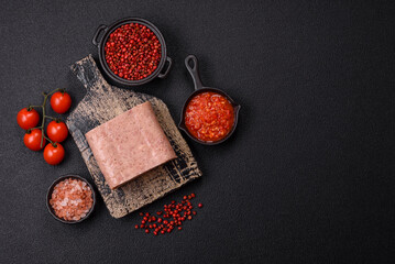 Delicious canned pink spiced ham or spam with salt, spices and herbs