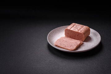 Delicious canned pink spiced ham or spam with salt, spices and herbs