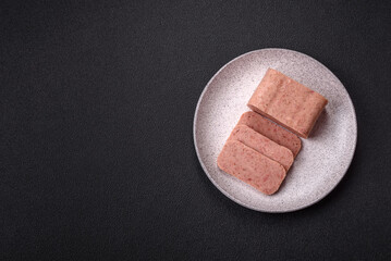 Delicious canned pink spiced ham or spam with salt, spices and herbs