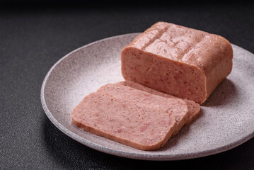 Delicious canned pink spiced ham or spam with salt, spices and herbs