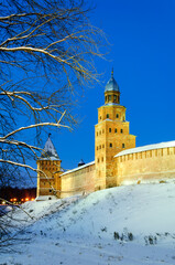 Fototapeta premium Veliky Novgorod Russia - December 8 2010. Kokui and Intercession towers of Veliky Novgorod Kremlin by winter night, Veliky Novgorod Russia