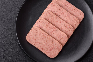 Delicious canned pink spiced ham or spam with salt, spices and herbs