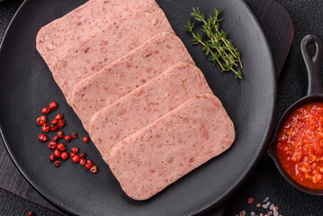 Delicious canned pink spiced ham or spam with salt, spices and herbs