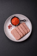 Delicious canned pink spiced ham or spam with salt, spices and herbs