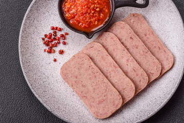 Delicious canned pink spiced ham or spam with salt, spices and herbs