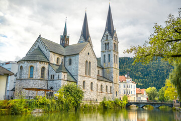 Slovenia, postcard view of the parish church of St. Jernej in the center of Kocevje along the Rinza River