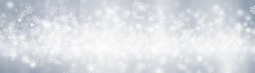 Blurred glitter effects background. Bright soft blue with hints of pearl color. Christmas background. Festive Christmas backdrop with holiday charm. Blurred bokeh light on dark blue background. Christ