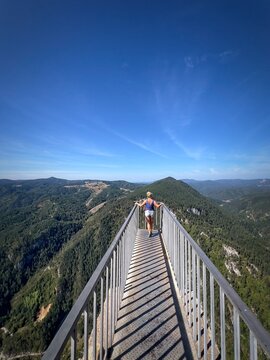 Rear view of a woman standing on Orlovo oko (Eagle's Eye) viewpoint, Rhodope Mountains, Bulgaria