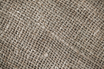 Close up background, natural craft brown linen fabric, thread weave, textile texture, perfect for backgrounds, textiles, wallpapers