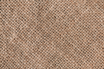 Close up background, natural craft brown linen fabric, thread weave, textile texture, perfect for backgrounds, textiles, wallpapers