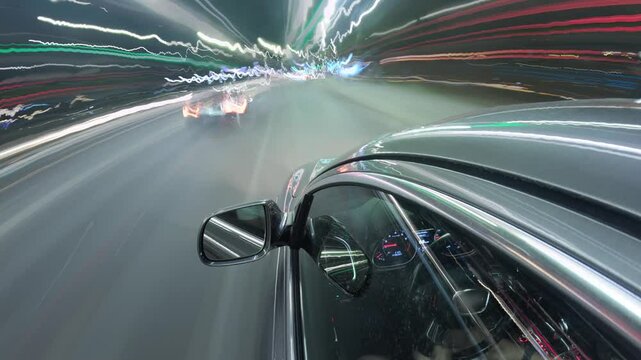 A time lapse video of night busy city from driving car. Town's light