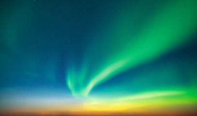 Aurora borealis in night winter sky. Sky with polar lights and stars. Waves of green Northern lights in Earth atmosphere