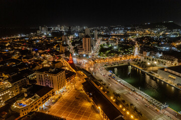 Fototapeta premium Beautiful Aerial view of the walled city of Cartagena de Indias in Colombia. Its Clock Tower entrance, the plaza, the sanctuary and the Domus Dei at night