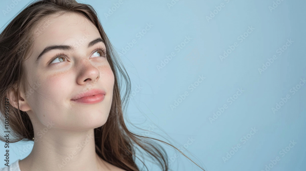 Wall mural side view young happy woman, close up, mock up area isolated on light blue background