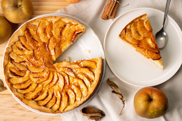 Autumn apple pie with pastry cream filling and jam cover,