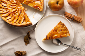 Autumn dessert of apple cake with pastry cream filling and jam cover