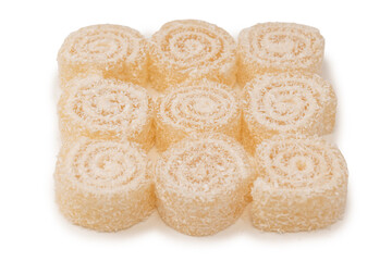 Coconut candy roll isolated on a white background.