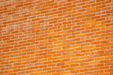 Refractory orange brick wall, textured background for design. Building wall concept