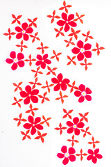 Simple floral vector seamless pattern. White, red, orange flowers on a light pink background. For fabric prints, textile products, summer clothes.