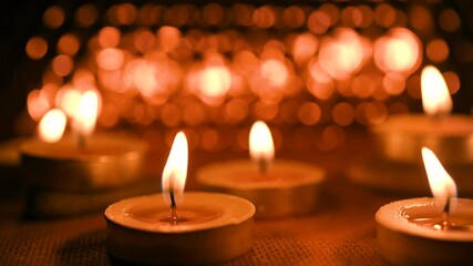 All Saints' Day greeting banner with bokeh effect. All Hallows' Day. Solemnity of All Saints. Candles with fire on shiny background