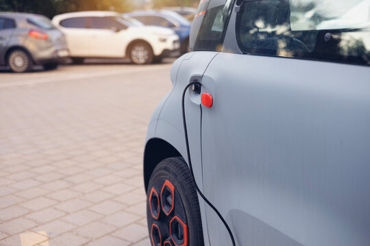 Electric car charging through plug on street. Citroen Ami charging station. ADANATURKEY. 100924
