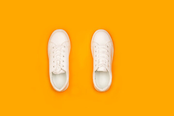 These pristine white sneakers are a timeless classic, perfect for any wardrobe. The clean lines and minimalist design create a versatile and stylish look.