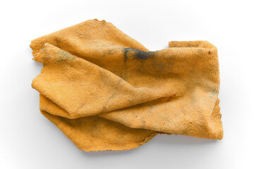 Dirty old unclean microfiber cloth with grease stains and cat hair. Grunge and rough surface of fabric on the table.	