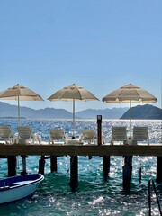 beach with umbrellas and chairs