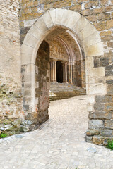 Obraz premium Gate to the Église Saint-Pierre in the village of Carennac in Lot Occitanie Southern France. The church was founded in the 11th century.