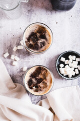 Trendy fluffy coke with marshmallow in  glasses on the table top and vertical view