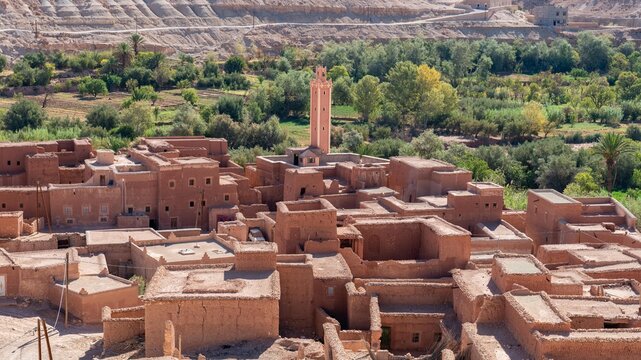 Erfoud town in the Tafilalet oasis, a tranquil desert town in Morocco surrounded by lush palm trees, blending natural beauty with traditional Moroccan architecture.