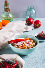 Spicy creamy mexican salsa in a bowl on the table vertical view