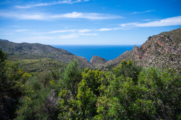 Serra de Tramuntana mountain landscape, Mallorca with sea in the background, wide angle shot, majorca