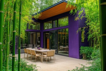 Obraz premium Stylish plum purple house surrounded by bright green bamboo, featuring large windows and a beige outdoor dining setup