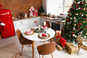 Kitchen interior with Christmas tree, new year decorations and served table