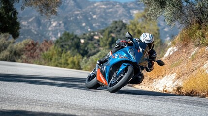 Blue and Orange Sportbike Leans Into a Mountain Curve