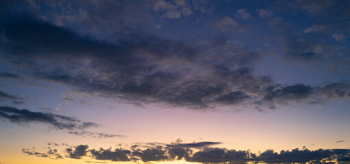 Sunrise Clouds background. Dramatic Clouds Sunset Background. Sky with clouds in Sunrise. Sunrise with clouds in various shapes background. Calm Cloud.