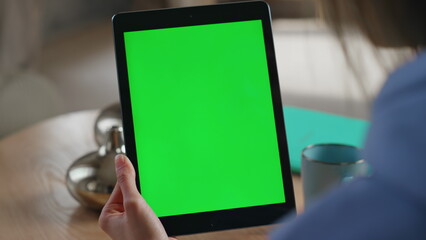 Woman working chromakey tablet at modern office workplace closeup. Unknown hands