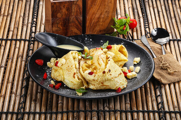Sweet banana pancake with honey