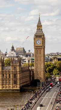 houses of parliament, river thames and westminster bridge in london in vertical