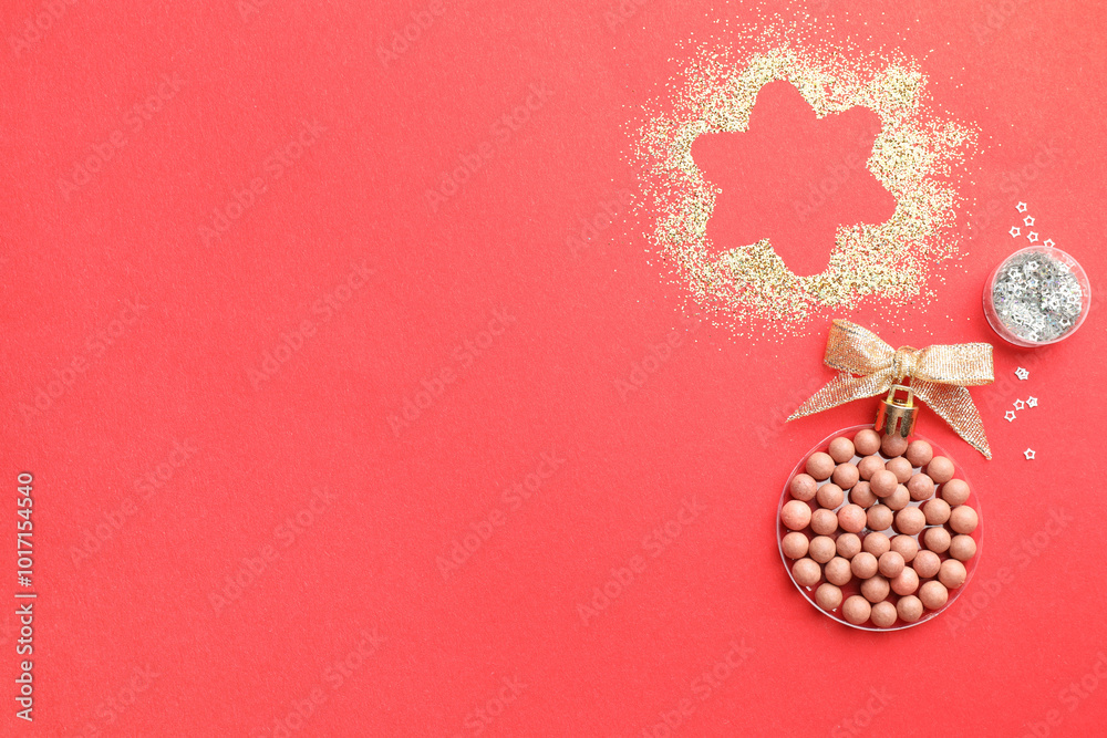 Poster Christmas ball made with blush and glitter on red background, top view. Space for text