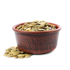 Peeled pumpkin seeds in bowl isolated on white