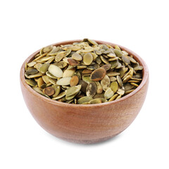 Peeled pumpkin seeds in wooden bowl isolated on white