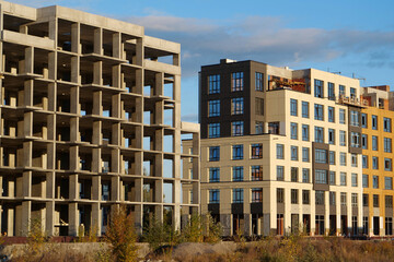Different stages of construction. Frame of unfinished concrete construction