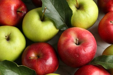 Ripe red and green apples on table, closeup