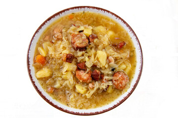  Kapuśniak - domowa, tradycyjna polska zupa z kiszonej kapusty z ziemniakami, boczkiem i kiełbasą