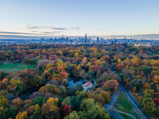 Aerial sunset landscape of Prospect Park in fall with Brooklyn Manhattan skyline New York City