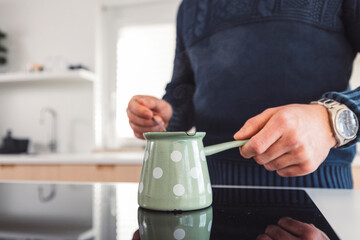 The couple go about their daily chores in the apartment. The couple talks in the kitchen, sits on the sofa, at the dining table.