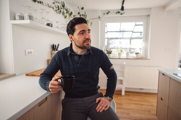 The couple go about their daily chores in the apartment. The couple talks in the kitchen, sits on the sofa, at the dining table.