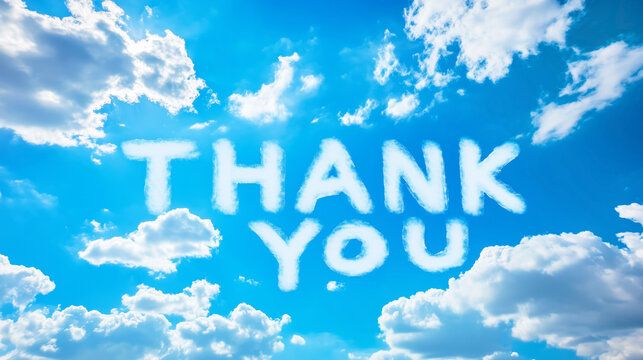 Thank you skywriting with fluffy white clouds against a bright blue sky